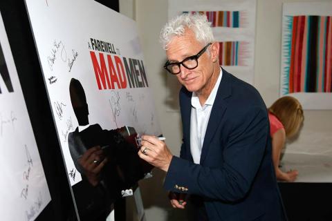 John Slattery signs the poster at "A Farewell to Mad Men," May 17, 2015 at the Montalbán Theater in Hollywood, California.