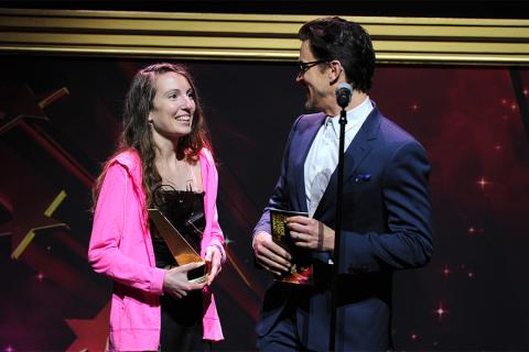 Matt Bomer presents an award to Melissa Hoppe at the 36th College Television Awards at the Skirball Cultural Center in Los Angeles, California, April 23, 2015.