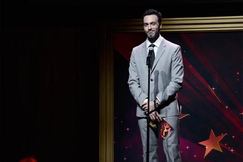 Reid Scott presents an award at the 36th College Television Awards at the Skirball Cultural Center in Los Angeles, California, April 23, 2015.