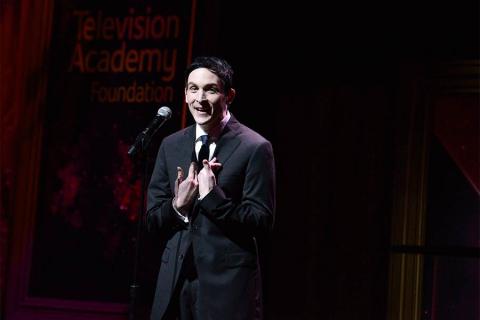 Robin Lord Taylor presents an award at the 36th College Television Awards at the Skirball Cultural Center in Los Angeles, California, April 23, 2015.