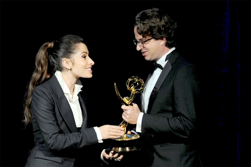 Host Sarah Shahi presents an Emmy to Daniel Sennheiser