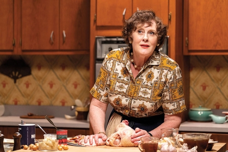 Sarah Lancashire, starring as Julia Child in HBO Max's Julia, appears in her show-within-a-show with a chicken — purchased and prepped by the show's food stylist Christine Toobin.